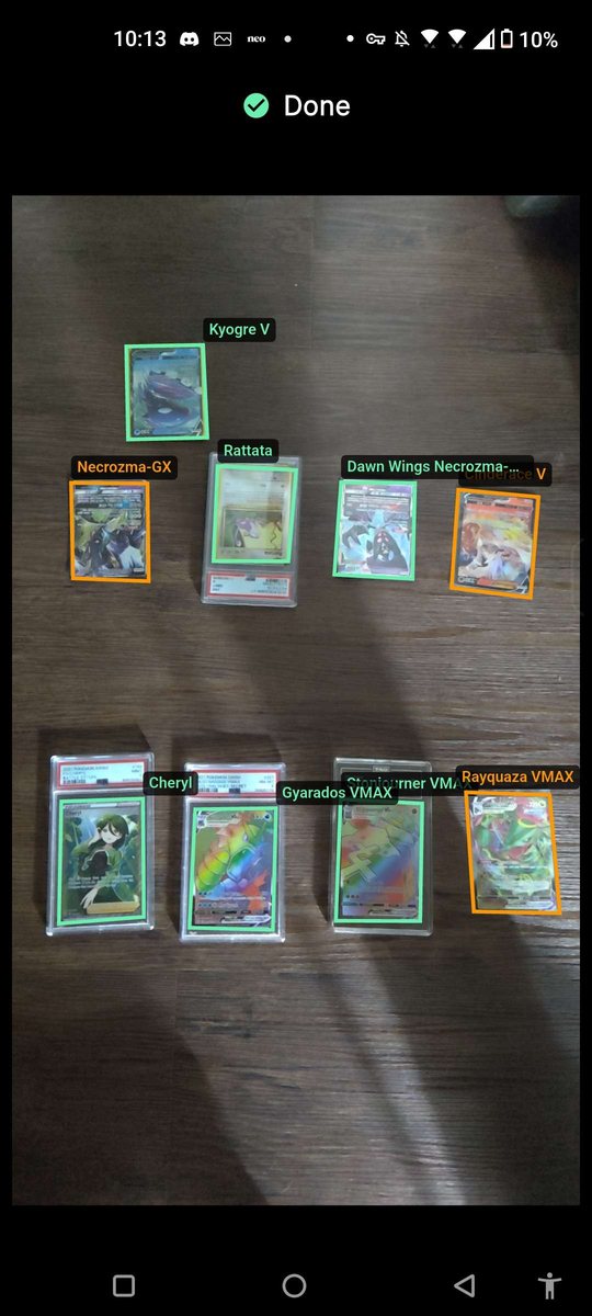 The card-exchange table-scan screen with detection boxes and card names drawn live over a full trade table: Kyogre V, Rattata, Necrozma-GX, Dawn Wings Necrozma, Cheryl, Stonjourner VMAX, Gyarados VMAX and Rayquaza VMAX all identified from one photograph.